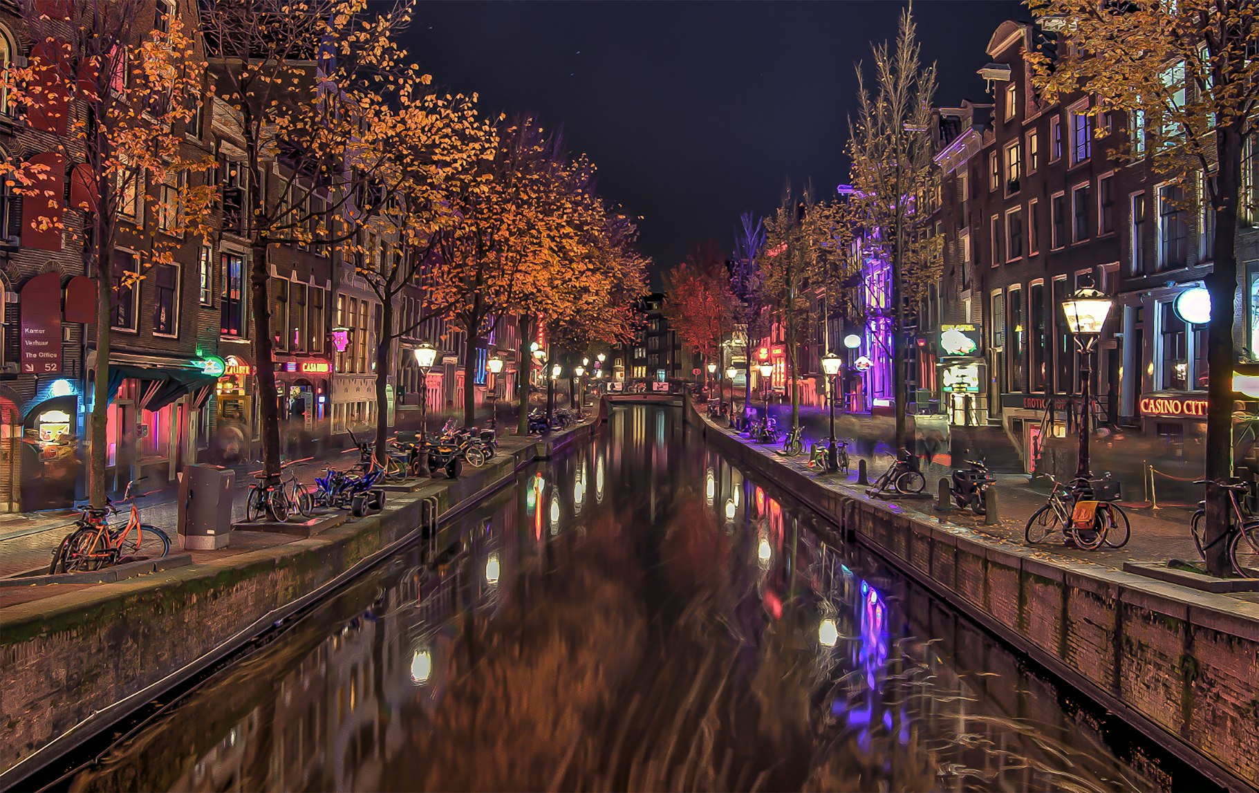 A long exposure photo of the view the famous Red Light District.